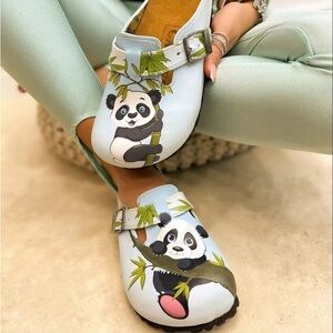 CALCEO LIGHT BLUE AND BROWN, GREEN TREE LEAFED, PANDA PATTERNED CLOGS SIZE 6.5